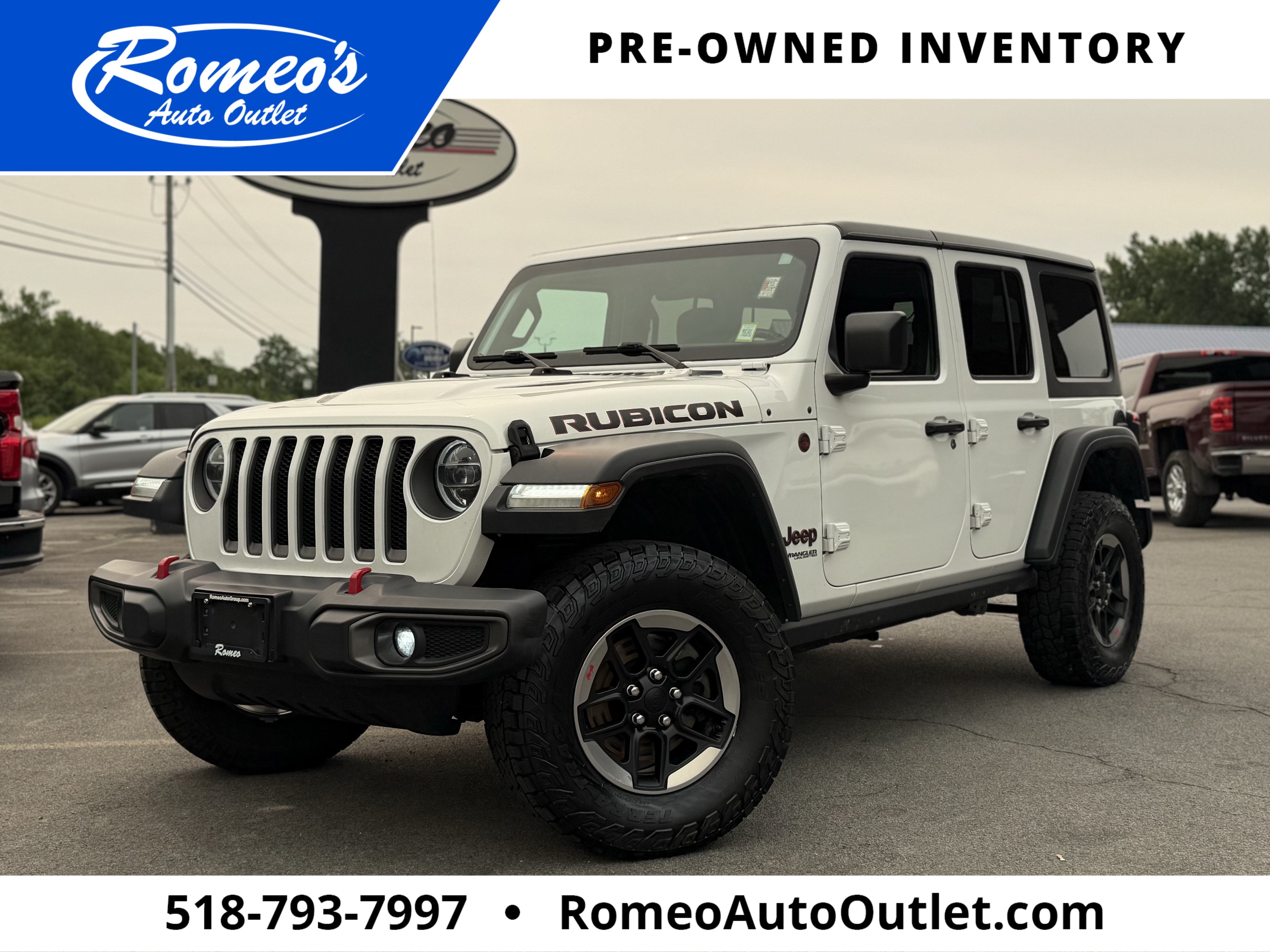 2019 Jeep Wrangler Unlimited Rubicon in Bright White Clearcoat — front three-quarter view