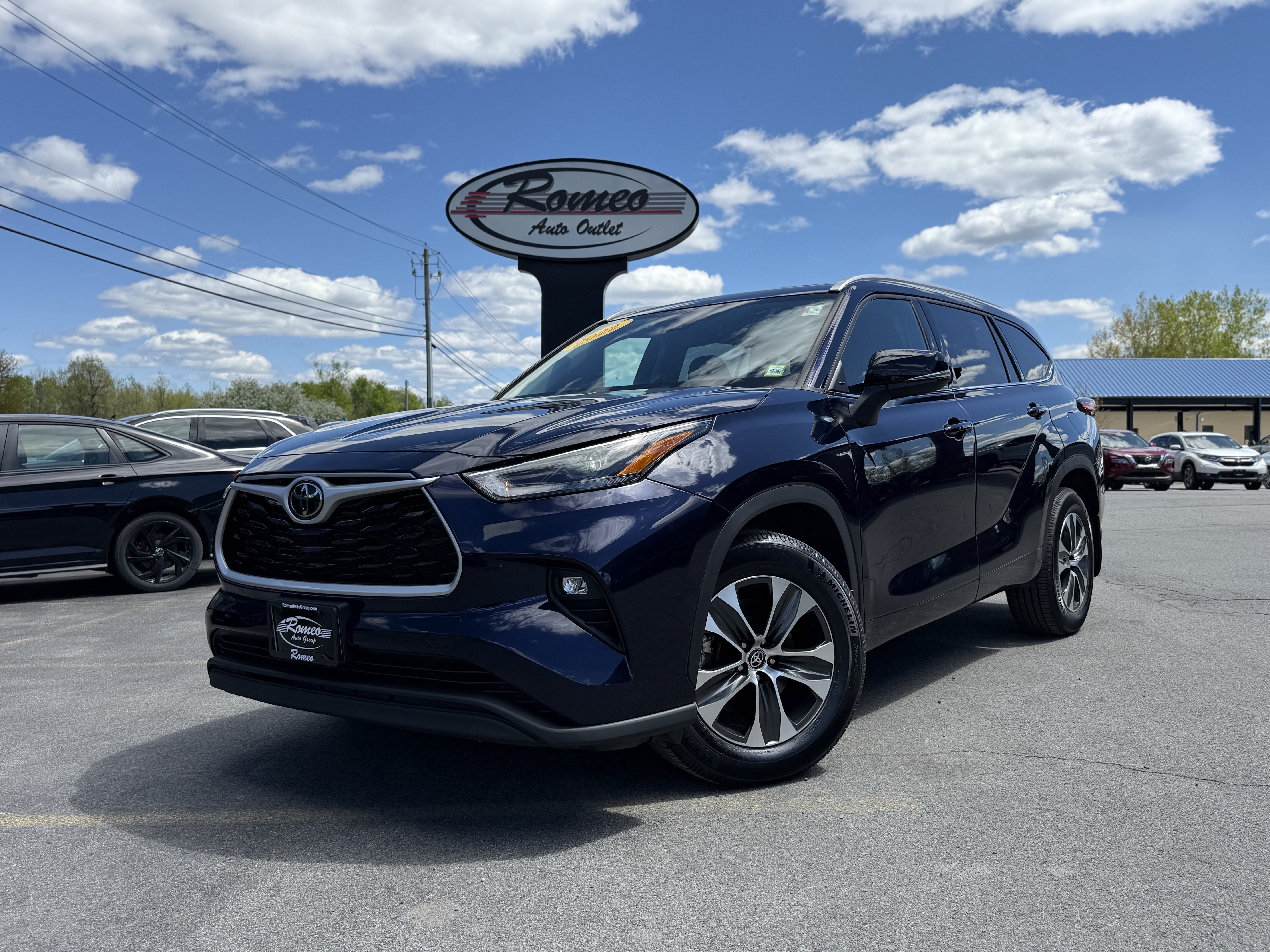2022 Toyota Highlander XLE in Blueprint — front three-quarter view