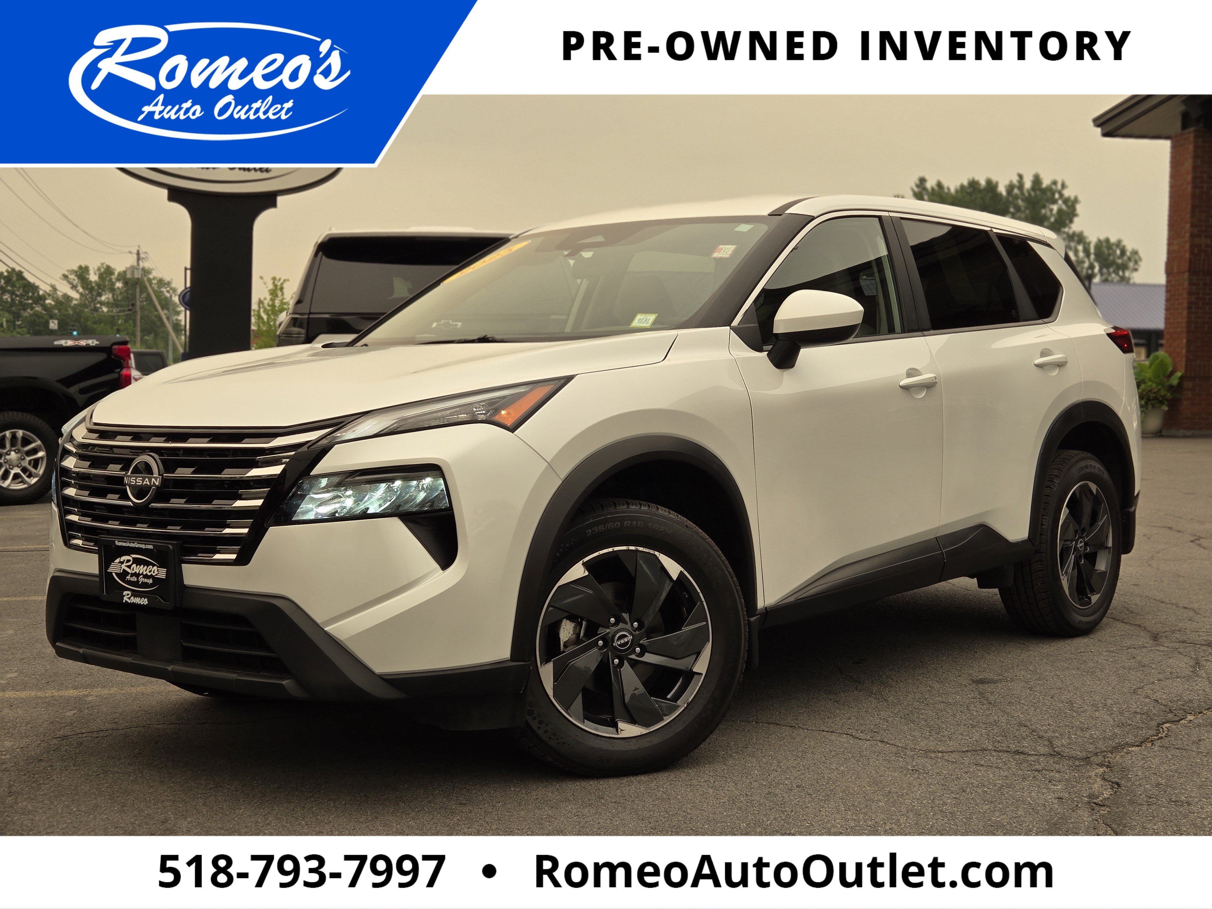 2025 Nissan Rogue SV in Everest White Pearl — front three-quarter view