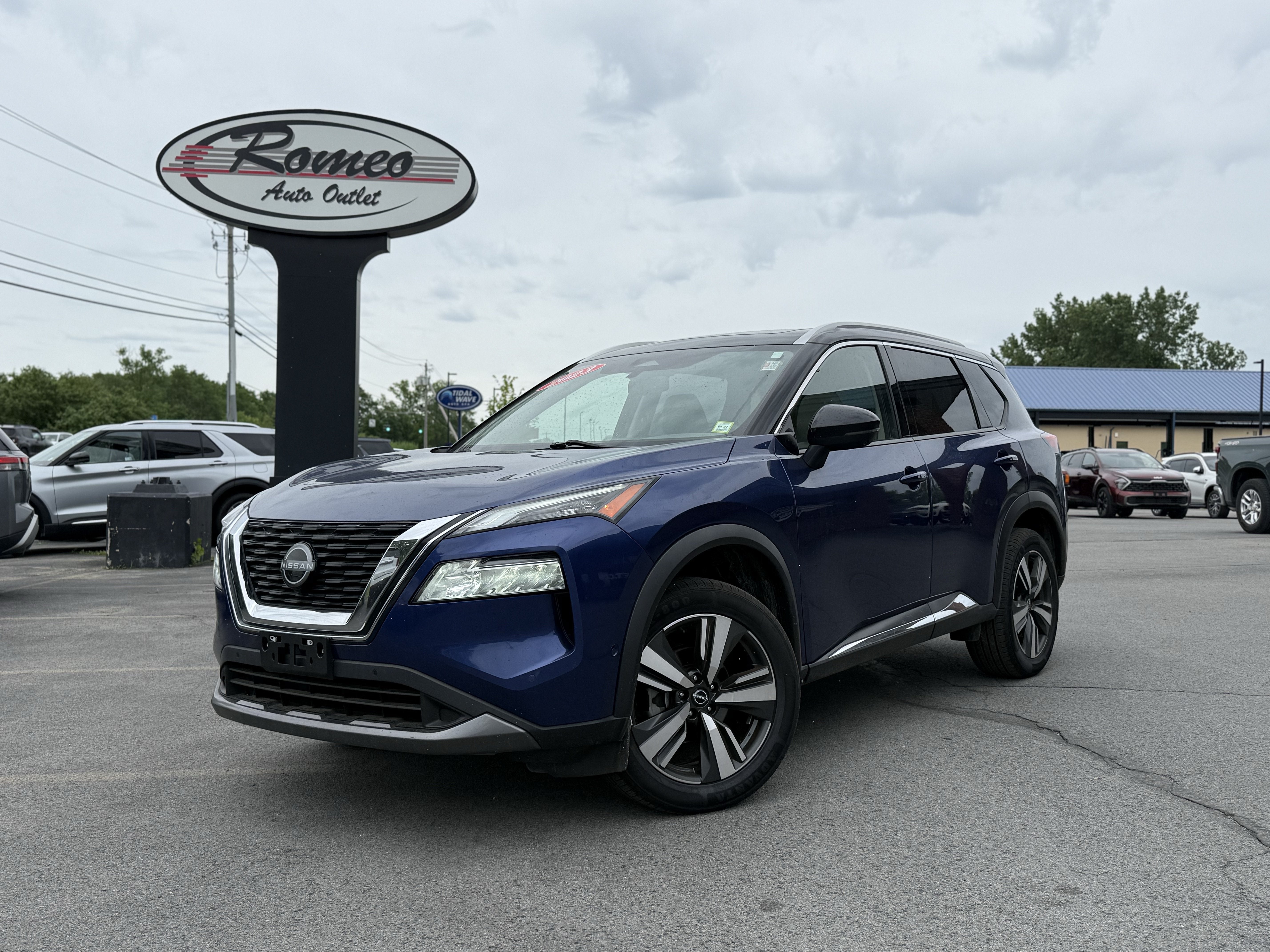 2023 Nissan Rogue SL in Caspian Blue Metallic/Super Black — front three-quarter view